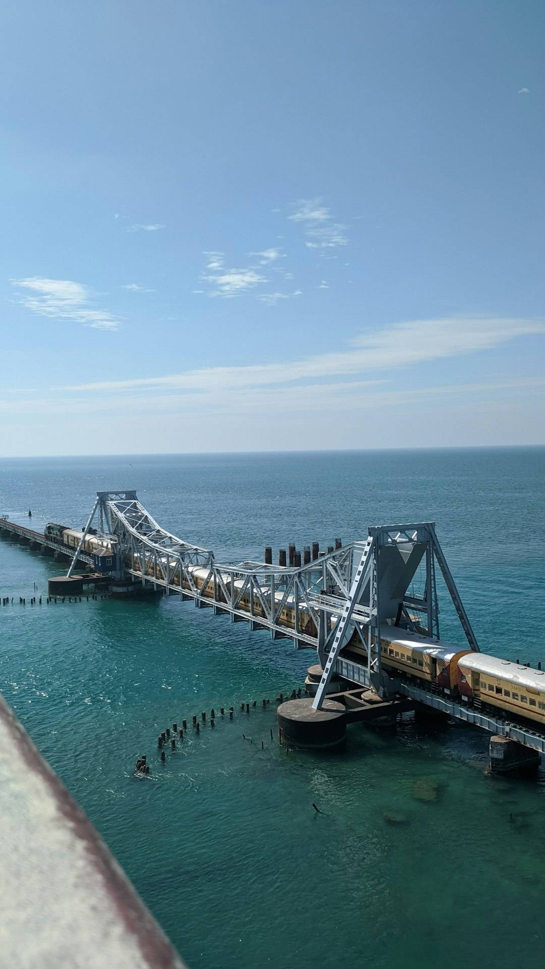 A train crossing the Pamban sea bridge to Rameswaram with water on both sides