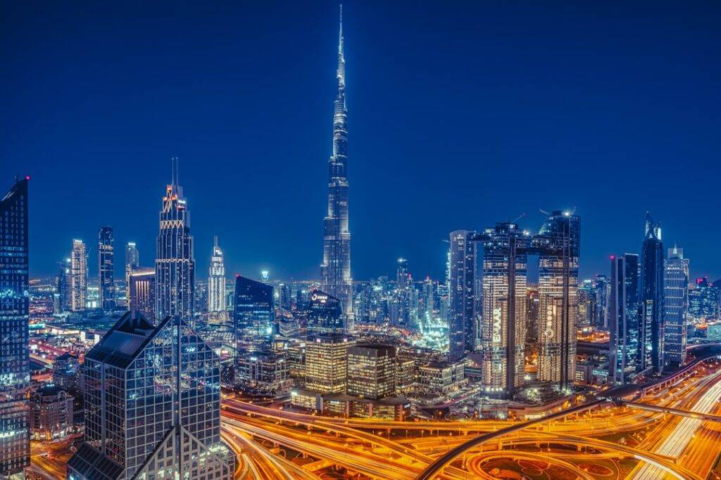 Burj Khalifa towering over the illuminated Dubai skyline at night